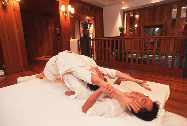 BANGKOK, THAILAND - 1997/07/01: A masseur works on a customer as he gives a traditional Thai massage at the famous Oriental Hotel Spa.. (Photo by Peter Charlesworth/LightRocket via Getty Images)